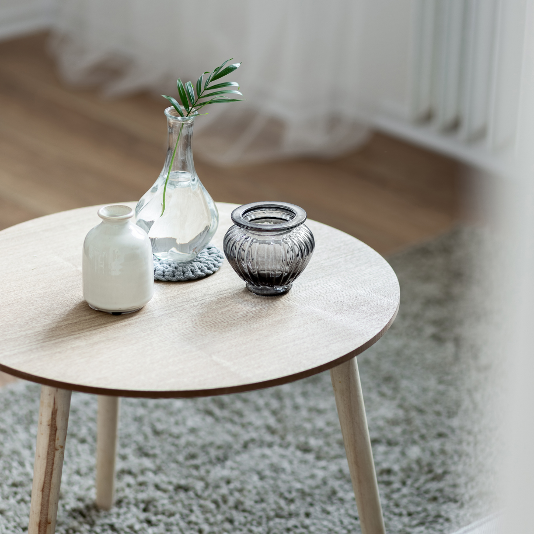 wooden coffee table on grey rug